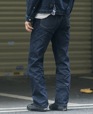 Indigo denim jeans with front button fly, belt loops, and stitched side seams