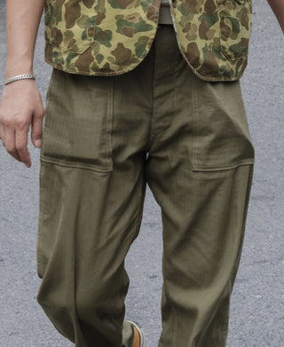 Olive utility fatigue trousers with cargo-style front pockets