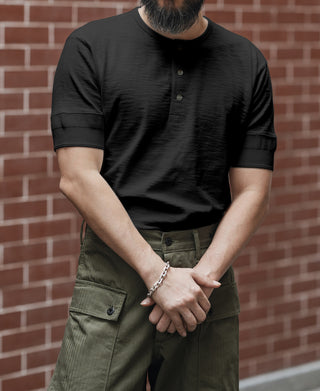 Black short-sleeve henley T-shirt with button placket and ribbed cuffs