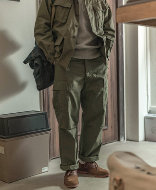 Olive cargo fatigue pants with multiple utility pockets and drawstring waist