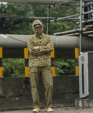 Olive utility fatigue trousers on model, straight leg at ankle length