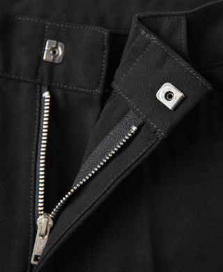 Black trouser front with double zippers and snap pocket