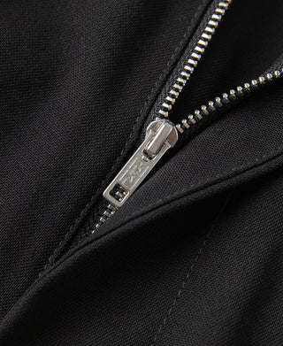 Close-up of metal zipper on black trouser fly