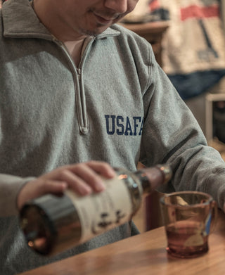 Gray half-zip sweatshirt with USAFA chest logo and zipper pull