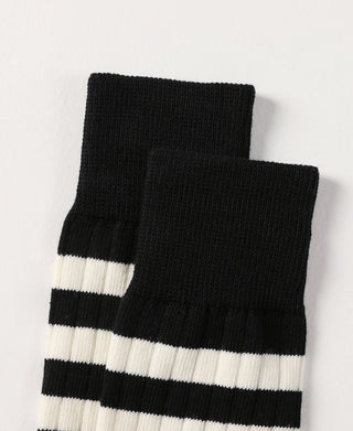 Black and white striped crew cotton socks, folded pair side view