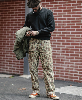 Black V-neck mechanics sweater with ribbed hem and cuffs