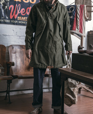 Olive cotton field parka with hood, front half-placket and drawstring toggles