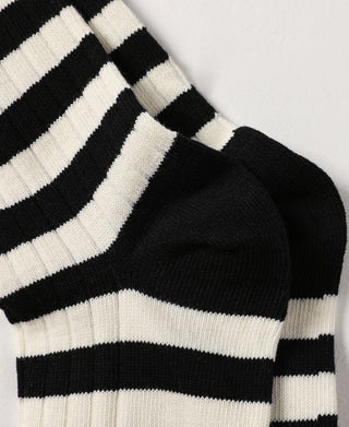 Black and white striped crew cotton socks, close-up of sock top and knit weave