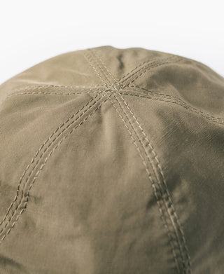 Olive nylon cap crown with stitched seam pattern