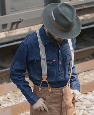 Khaki striped Y-back leather button suspenders worn with metal ring clips