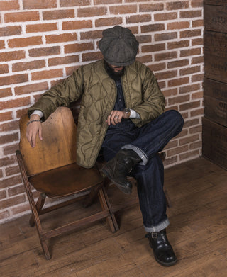 Olive quilted field jacket liner with snap-front and stand collar