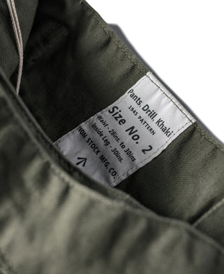 Olive bermuda shorts inside size label near waistband