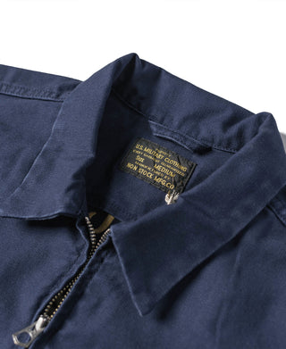 Navy tour jacket with interior neck label and metal zipper pull detail at collar