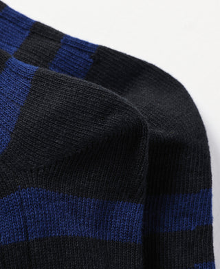 Cotton socks in black with bold blue striped bands, ribbed knit cuff