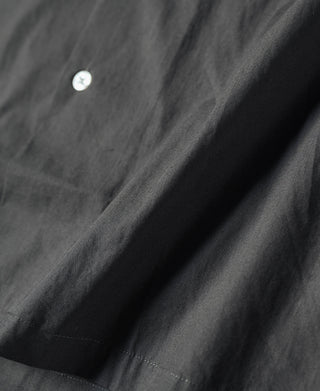 Dark gray open-collar shirt front with single button
