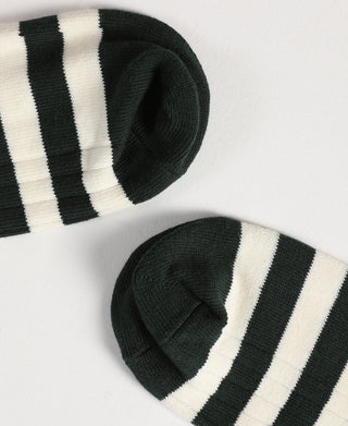 Folded green and white striped socks showing knit texture