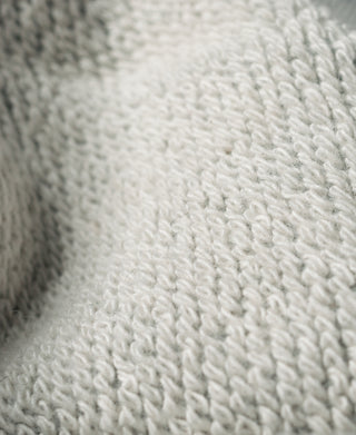 Light-colored cotton-terry fabric texture close-up