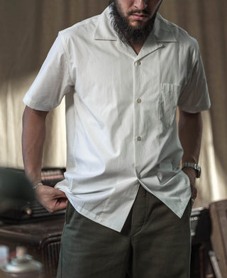 Ivory open-collar short-sleeve shirt with button placket and chest pocket