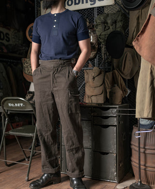 Navy henley t-shirt on model, short sleeves and three-button placket