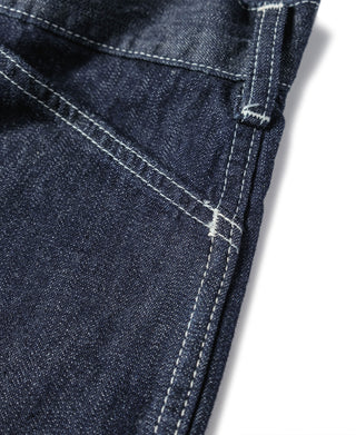Indigo denim hem detail with visible stitched seam and folded cuff edge