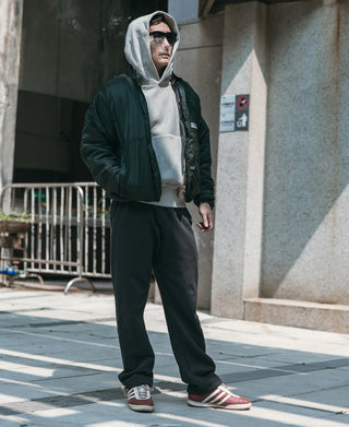 Black heavyweight terry sweatpants with drawstring waistband and side pockets