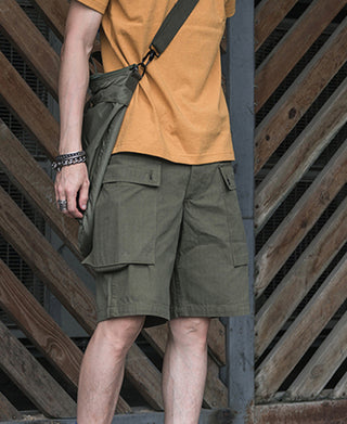 Olive utility cargo shorts with flap side pockets and button waist detail