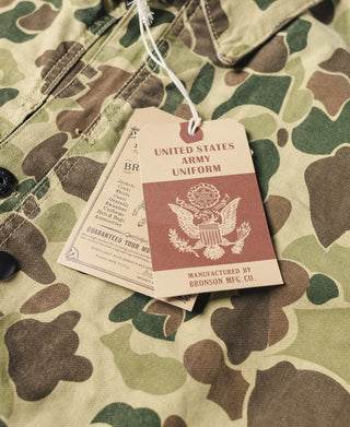 Camouflage jacket neck tag and drawstring with snap button closure