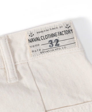 Inside label on white herringbone deck pants with stitched size tag