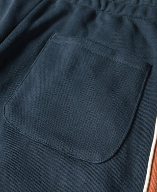 Navy cotton-terry sweatpants with front pocket and stitched waistband