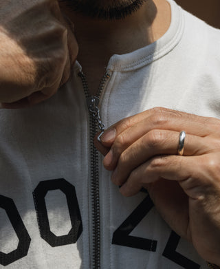White quarter-zip t-shirt zipper with '02' print detail