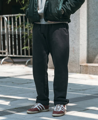 Black terry sweatpants, relaxed straight leg with elastic waist and cuffed hem
