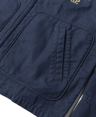 Navy tour jacket front pocket and stitched placket detail, close-up