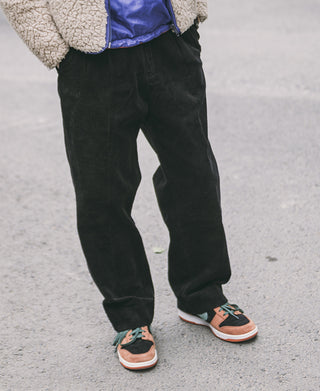 Black corduroy trousers with roomy wide-leg silhouette