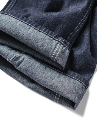 Indigo denim fatigue dungarees, stacked cuffs with contrast topstitching