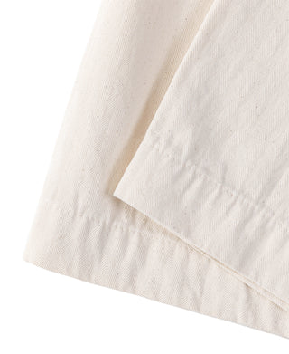 White herringbone deck pants hem with stitched double-fold edge