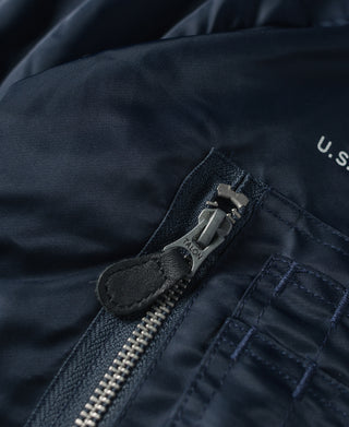 Navy flight jacket front zipper with TALON pull and stitched placket