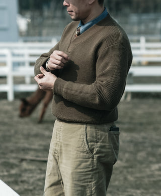 Olive V-neck mechanics sweater with ribbed hem and cuffs