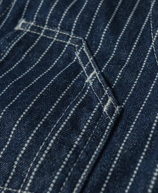 Indigo denim work vest with seam stitching and narrow strap detail