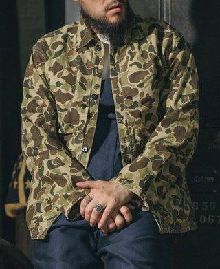 Camouflage camo jacket worn by model with button front and chest pockets