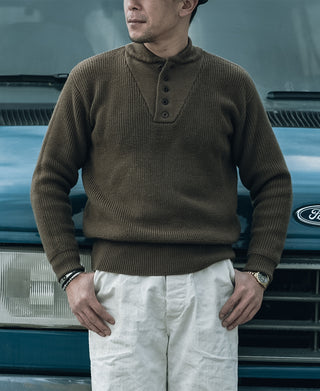 Olive wool high-neck henley sweater with four-button placket and ribbed cuffs