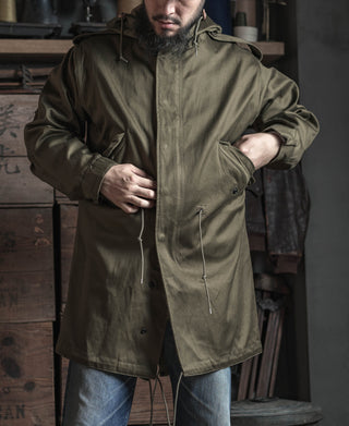 Olive drawstring-hood parka with front zipper and side button pockets