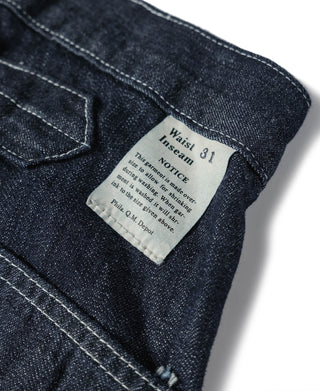 Indigo denim fatigue dungarees, interior label with care and size text