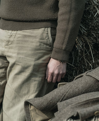 Olive ribbed cuff and knit hem of V-neck mechanics sweater