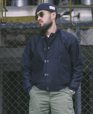 Navy deck hook jacket with hood, toggle front, and ribbed knit cuffs