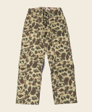 Reversible duck hunter camo pants in green and tan camouflage pattern, full front view