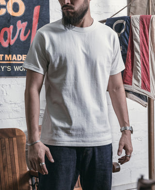 White crew-neck athletic t-shirt with short sleeves and relaxed fit