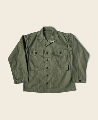 Olive green HBT jacket with button front and two chest flap pockets