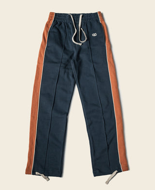 Navy cotton-terry straight-leg sweatpants with rust side stripe and drawstring waist