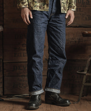 Dark indigo selvedge denim jeans with contrast cuff stitching and straight legs