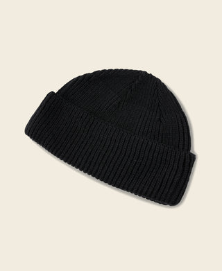 Black rib-knit watch cap with folded cuff, knit texture